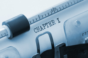 Our editors explain how to flesh out your plot. A close-up photo of a piece of paper in a typewriter that begins the plot of a story and reads "Chapter 1."
