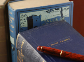 Our editors offer helpful tips for authors writing short stories. There is a book of tips for writing short stories and one about short stories. There is a pen on top of one of the books.