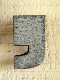 OUr editors explain what a comma is and highlight some common comma rules. A comma key from a movable type machine is pictured.