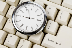 Our editors offer some helpful time managements skills for authors. These will allow them more time to write. A pocket watch sits on top of a keyboard. This shows the importance of time management skills in finding time to write.