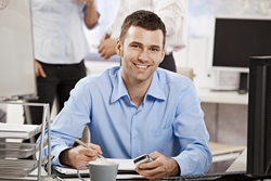 Follow these tips to help you write a great introduction letter. Casual young businessman working in office, sitting at desk, and writing notes.