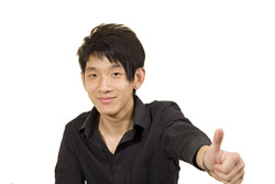 Our editors provide a college recommendation letter sample. A male student who is wearing a black shirt and giving the thumbs up. He is happy because he just received a good college recommendation letter.
