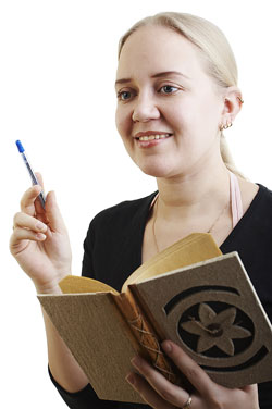 Scribendi.com's editors compile their top 10 favorite editing quotes of all time. A young poet is standing with her book reading editing quotes.