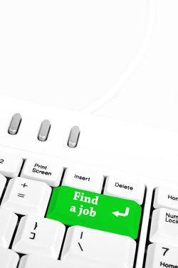 Scribendi.com's editors explain how online resumes are the new way to apply for employment. A white keyboard with a green "Find a Job" button.