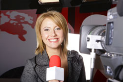Our editors provide a press release example. A female anchorwoman is delivering a press release example in front of the camera.