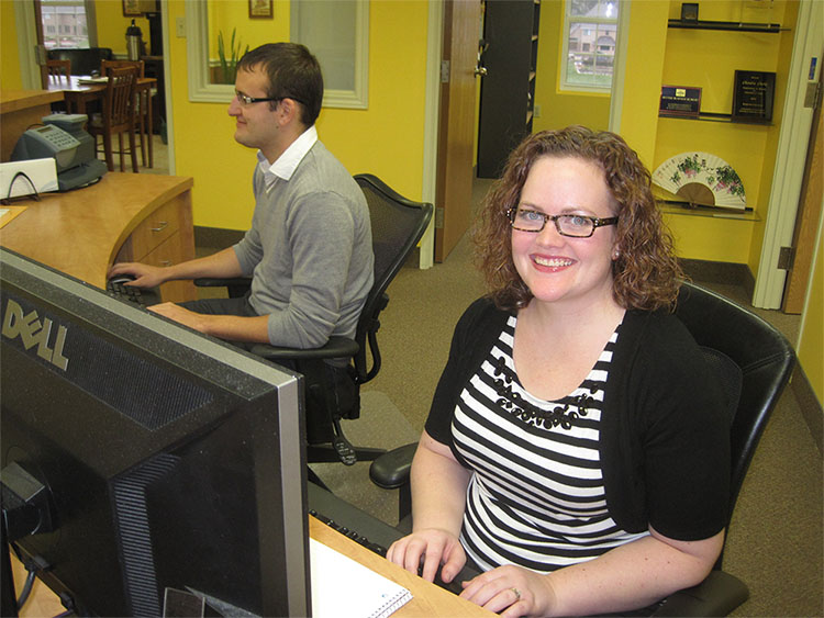 Customer Service Specialist Heather Laroche, and Dillon Amlin, working hard at the Scribendi.com customer service desk.