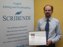 Scribendi.com Vice-President stands with the Ontario Global Traders Award, which recognized Scribendi.com as one of Canada's top exporters.