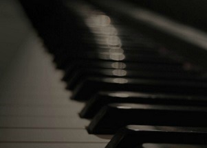 The keys of a piano represent the Click-Clacker.