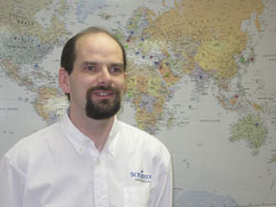 Scribendi.com Vice-President, Terence Johnson, is standing in front of a world map; this indicates that he is one of Canada’s top immigrants.