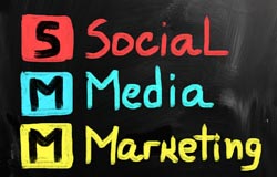 Some tips and tricks on how to use social media for marketing. Social media marketing and its acronym, SMM, are spelled out in colorful writing.