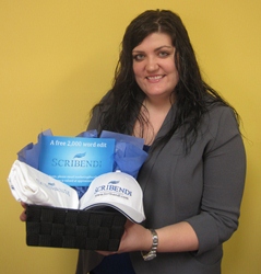 Woman holding a donation basket containing a t-shirt, a baseball cap, and a coupon.