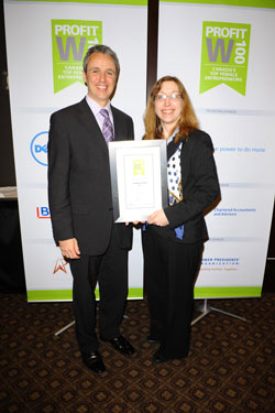 Scribendi.com President, Chandra Clarke, is holding her W100 plaque.