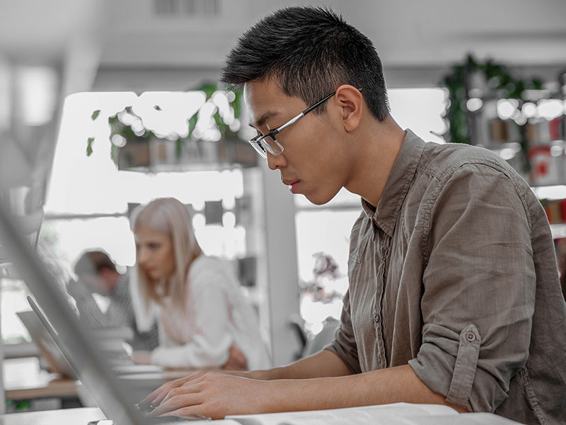 A man working at a computer.