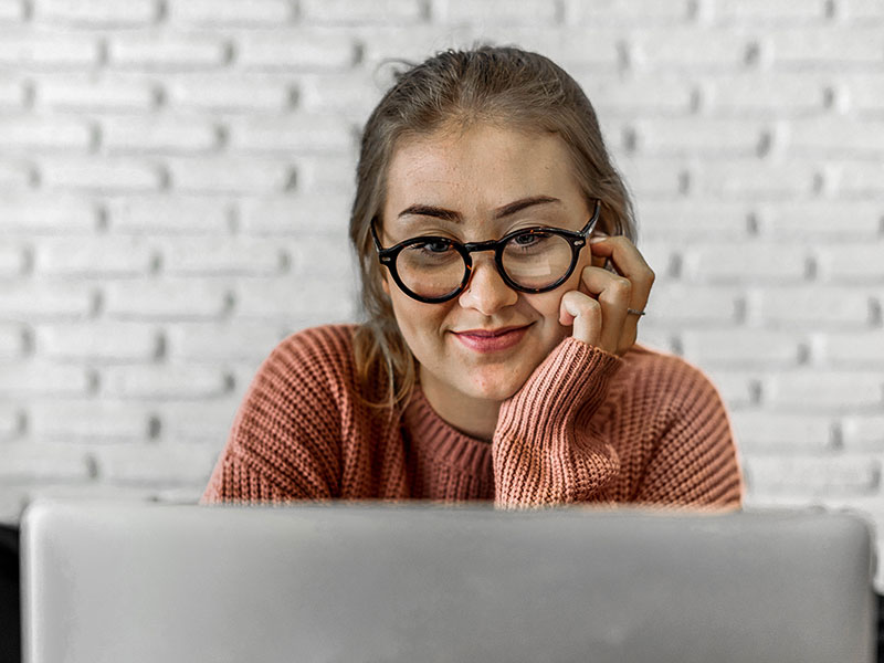 A student working at her computer.